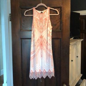 Beaded white and coral shift dress.
